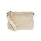 Detailed shot of the modern western whipstitch trim and durable brass-plated hardware on a vegan leather bag. clutch view