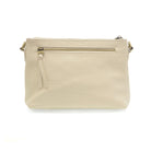 The Oakleigh bag shown as a vegan leather wristlet with a secure top zip and exterior storage. rear view

