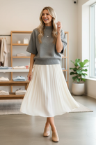 Heather grey mock neck knit sweater top with ribbed cuffs and hem styled with flowy midi skirt and mules, candid lifestyle boutique fashion photo at Thread Bar Boutique