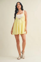 Gingham athleisure play dress with built-in shorts and bra in lemon from Thread Bar Boutique perfect for active days and casual outings front view