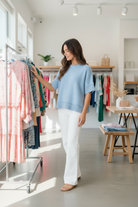 Blue half sleeve sweater with crew neck and laid-back drop shoulder style