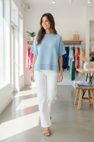 Blue crew neck sweater top with drop shoulder design and relaxed oversized fit