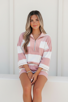 Striped lounge shorts with high-stretch waistband and functional pockets paired with a matching half-zip top