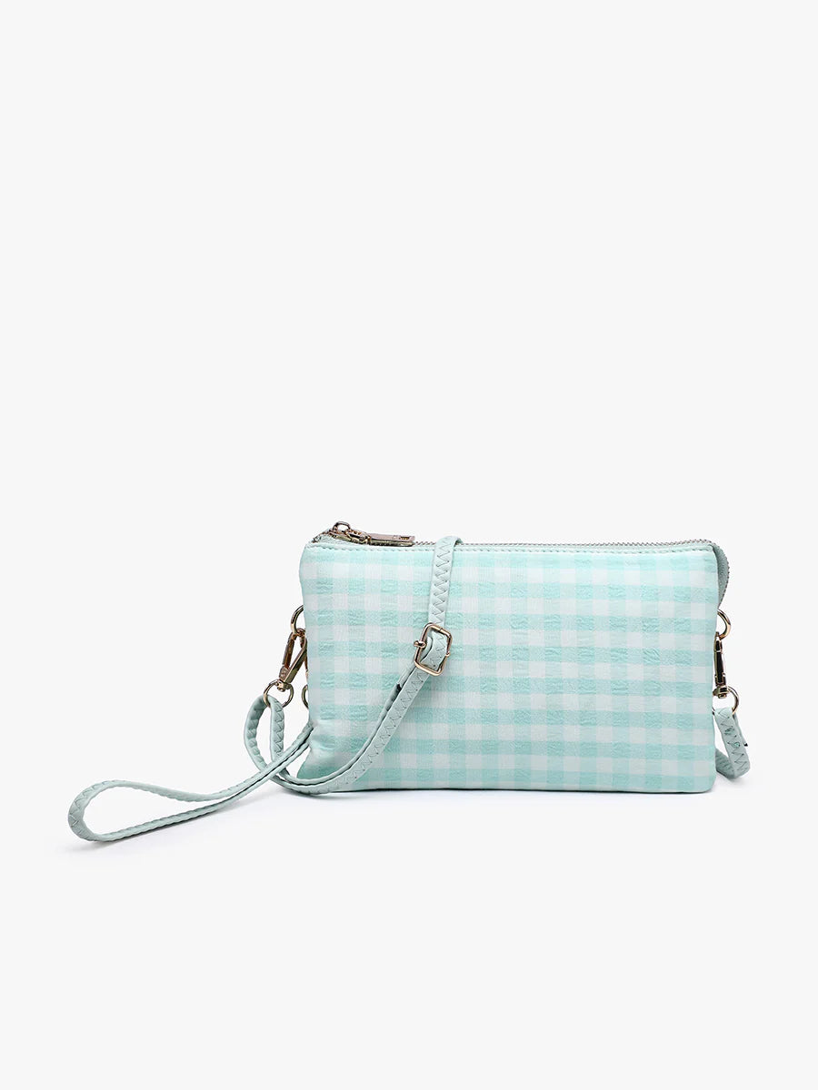 Riley crossbody bag in vegan leather with multiple compartments, card slots, and adjustable strap for everyday wear