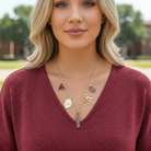 Gold paperclip chain necklace with Oklahoma Sooners themed charms, including OU logo, heart, bow, and script lettering, adjustable 16-inch length