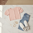 Chic pink puff sleeve sweater cardigan with short sleeves and comfortable knit fabric for layering fLat lay