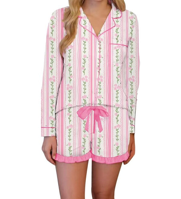 Pink striped floral pajama set featuring breathable fabric, relaxed fit button down top, and ruffled shorts for everyday lounging