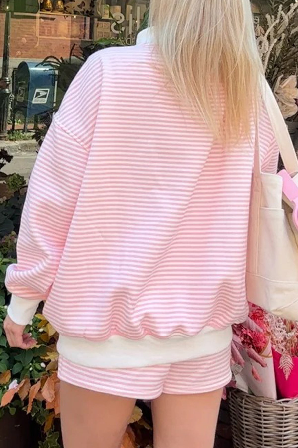 Women’s pink striped sweatshirt and shorts set with relaxed oversized fit
