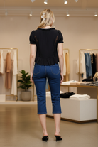 Women’s ruffle blouse with tie front, short puff sleeves, and breezy lightweight fabric