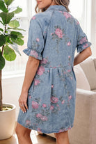 Woman wearing a floral denim dress in a home setting