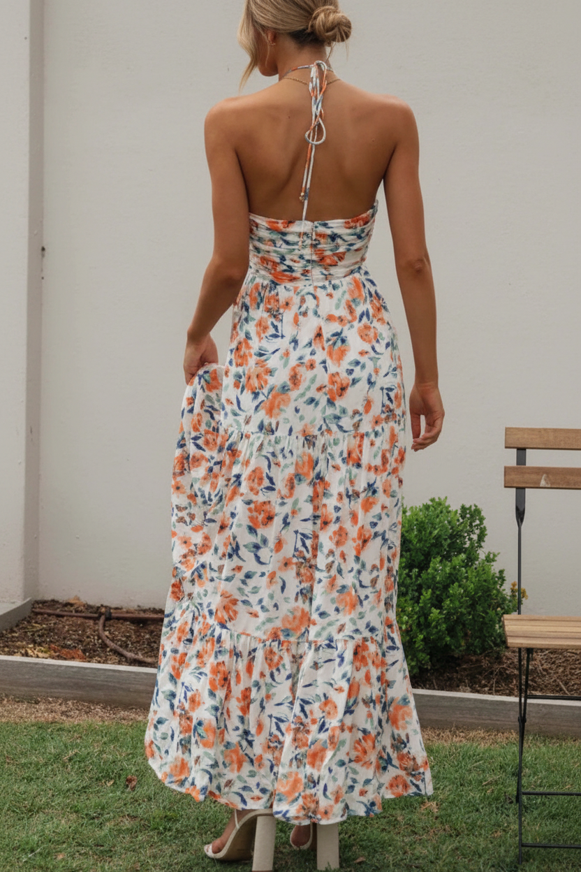 Floral halter midi dress from Thread Bar Boutique featuring ruched front, open tie back, and flowy feminine silhouette rear view