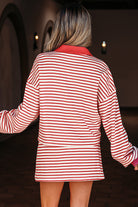 Trendy red stripe two-piece outfit from Thread Bar Boutique featuring collared pullover and skort with built-in shorts for comfort