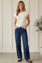 Entro cream lace trim sweater top with a round neckline, cap sleeves and lightweight fine knit fabric.