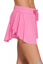 Lightweight ruffle tennis skort with stretchy fit, built-in shorts, and secure pockets, activewear essential from Thread Bar Boutique