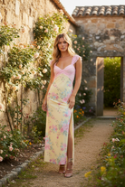 Feminine yellow and pink floral dress with sweetheart neckline, airy mesh fabric, and a flowing maxi length perfect for special occasions