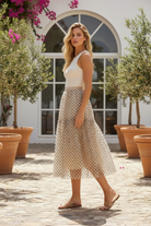Thread Bar Boutique beige midi skirt with playful black polka dots, flattering below-the-knee length for everyday or special occasions