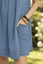 Thread Bar Boutique women’s denim mini dress with stone washed finish, pleated bodice detail, pockets and relaxed everyday boutique style.