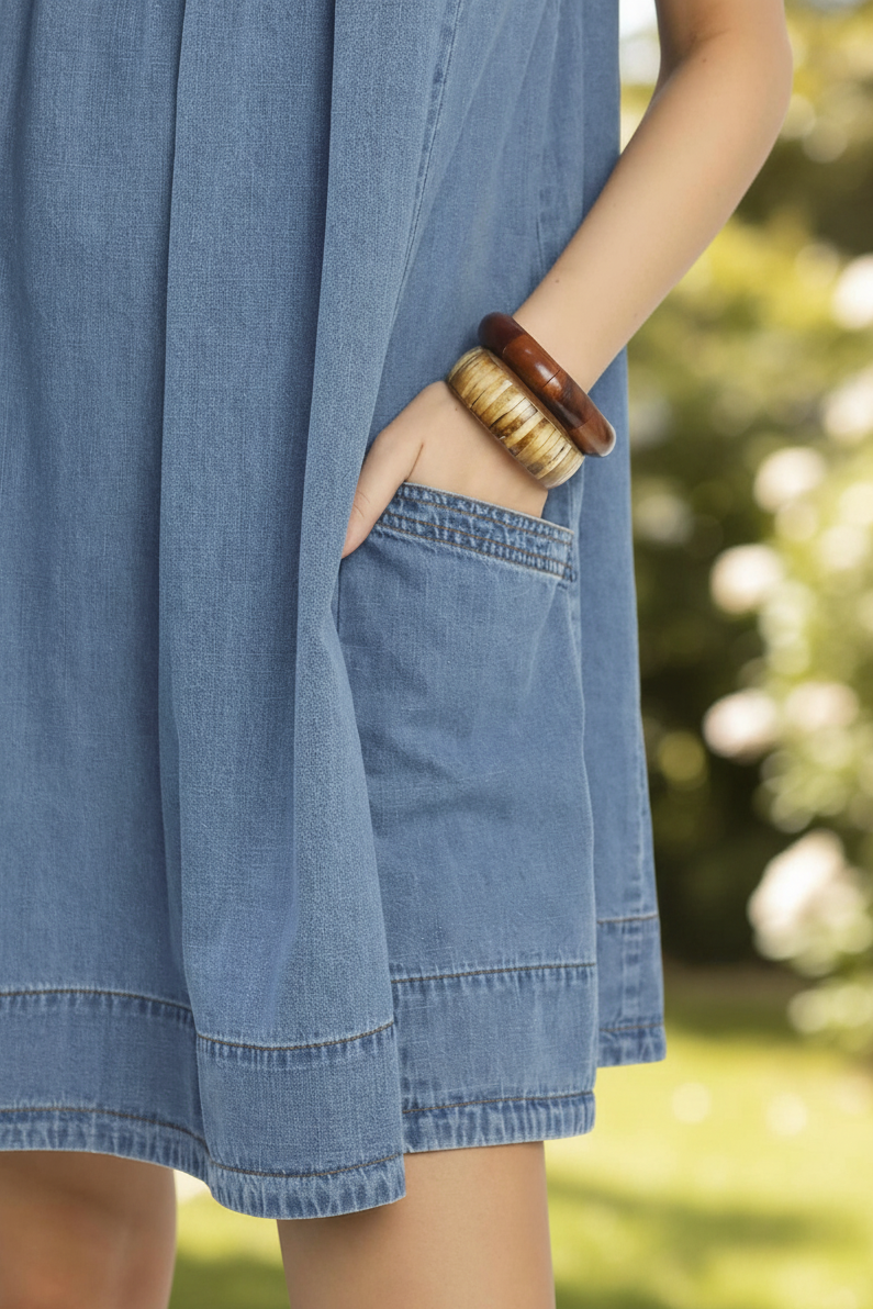 Thread Bar Boutique women’s denim mini dress with stone washed finish, pleated bodice detail, pockets and relaxed everyday boutique style.