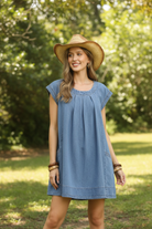 Thread Bar Boutique stone washed denim mini dress by Umgee with pleated bodice, cap sleeves, and relaxed casual boutique style.