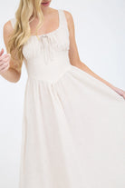 A coastal chic fashion staple, this sleeveless striped dress is made from a lightweight, breathable fabric. The image captures the crisp texture of the taupe stripes and the structured yet airy drape of the A-line summer dress silhouette taupe and white
