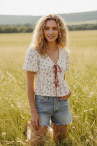 Ditsy floral tie-front top in breathable cotton gauze with a relaxed, lightweight fit that pairs perfectly with high-waisted bottoms