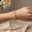 CZ triple heart bangle with polished stainless steel and sparkling crystal details