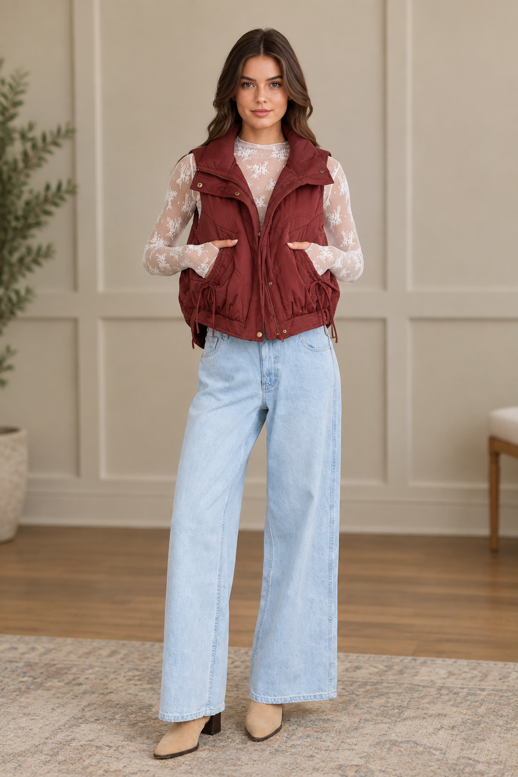Maroon wave quilted puffer vest with stand collar, gold snap buttons, and side pockets from Thread Bar Boutique