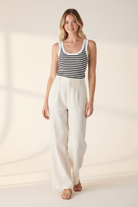 Nikibiki white black striped ribbed tank top - styled with linen trousers and strappy sandals