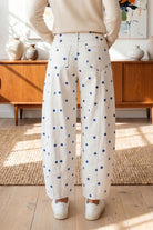 white barrel jeans with blue polka dot print