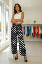 Chic black polka dot wide leg trousers with elastic waistband and lightweight fabric