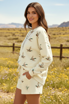 Duck print two-piece set for women featuring a long sleeve sweatshirt-style top and relaxed drawstring shorts with pockets