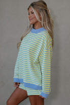 yellow and blue striped mock neck pullover and shorts matching set for women, trendy stripe two piece lounge outfit with color block trim, women’s striped matching set featuring mock neck top and loose fit shorts, casual boutique striped outfit set