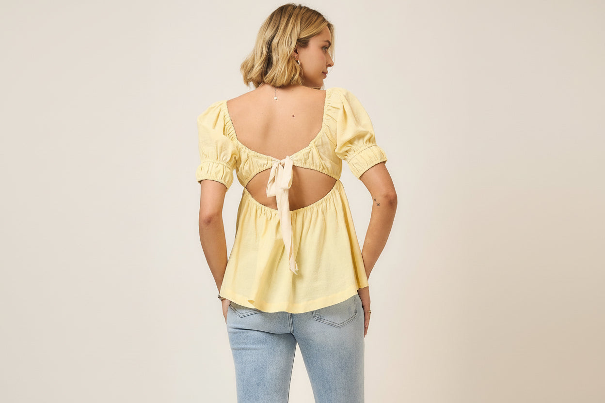 rear view of yellow top with ribbon tie back