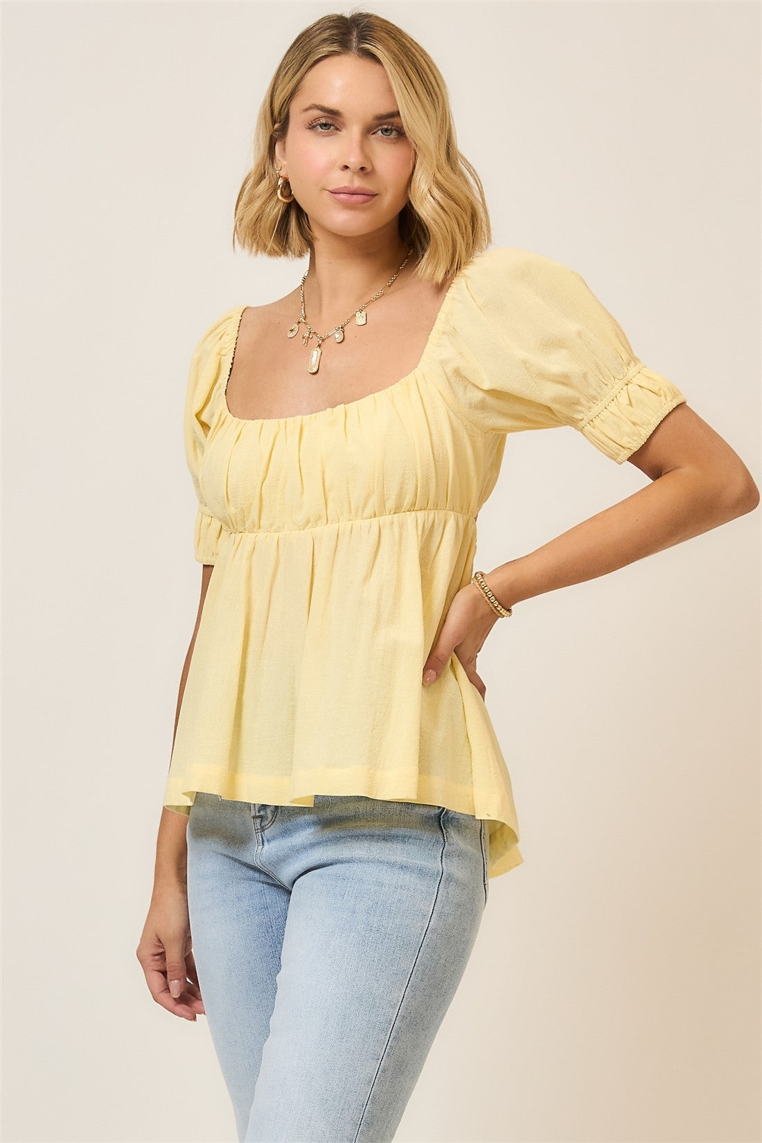 yellow peplum top with back ribbon tie

